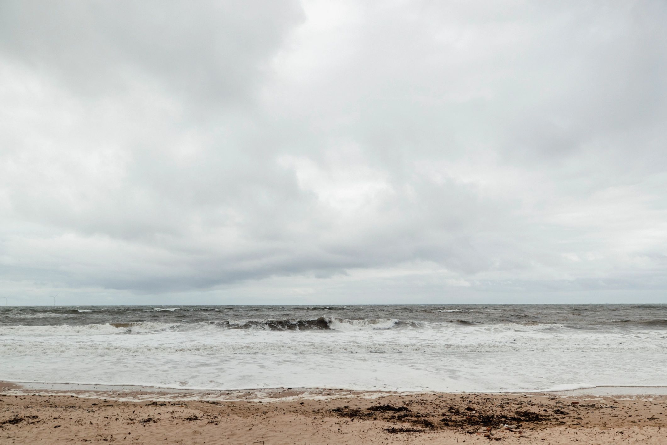 Stormy coastline under heavy clouds