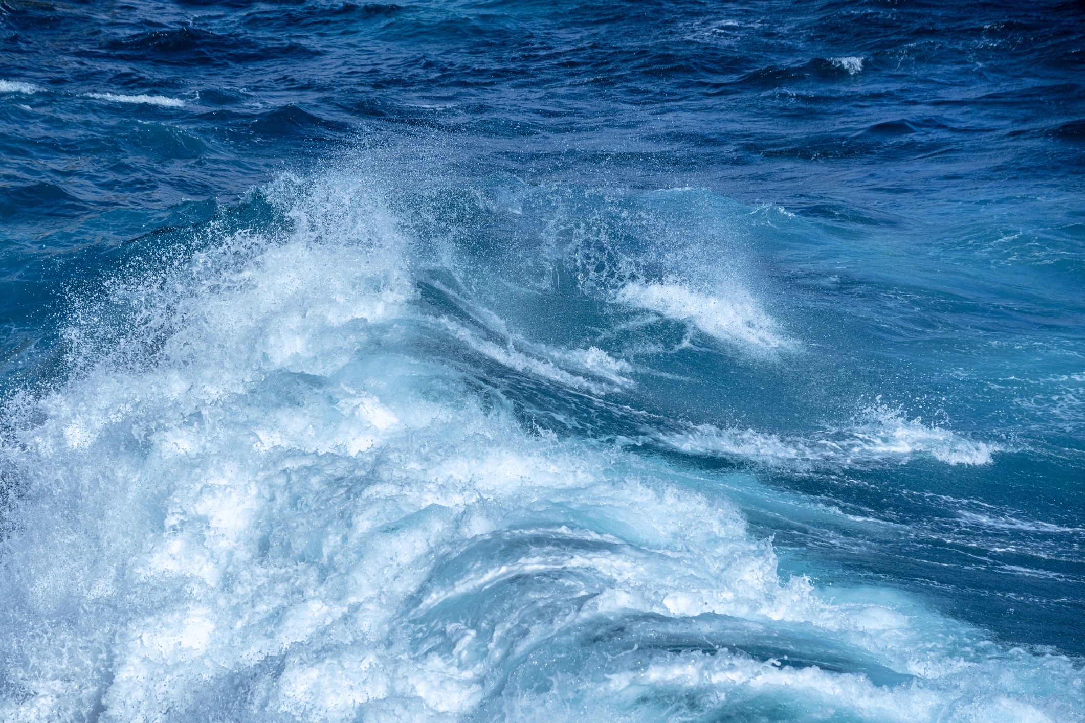 Powerful ocean waves crashing along a rocky coastline